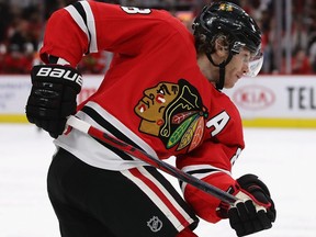 Patrick Kane of the Chicago Blackhawks ends up with half of a stick after breaking it firing a shot against the Winnipeg Jets during NHL action at the United Center in Chicago, Jan. 19, 2020.