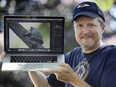 Mike Evans displays a photo on Tuesday, June 30, 2020 of a rare gray tree frog that he photographed in a South Windsor sanctuary recently.