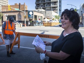 Debi Croucher, Executive Director of the Downtown Business Improvement Association, oversees the establishment of Friday, July 24, 2020 road closures.