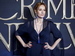 In this file photo taken on Nov. 13, 2018, British author and screenwriter J.K. Rowling poses upon arrival to attend the U.K. premiere of the film "Fantastic Beasts: The Crimes of Grindelwald" in London.