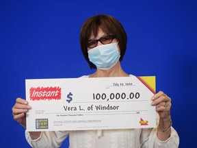 Vera Lulic, 78, of Windsor, with her $100,000 prize cheque from playing an Instant scratch game.