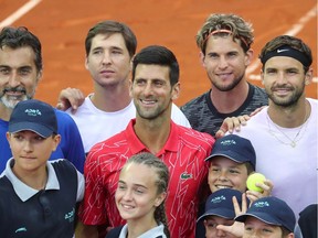 Novak Djokovic, centre, is shown with others during Adria Tour at Novak Tennis Centre in Belgrade, Serbia, June 12, 2020.