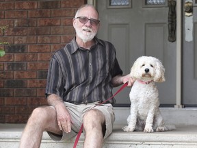 Thom Rolfe is retiring as executive director of Hiatus House. He is shown at his LaSalle home on Monday, July 13, 2020 with his dog Maggie.