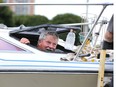 Boat captain Rick Kriza peers from the bow ventilation hatch of his 25-foot Doral Citation as he and friend Bob Jasin (not shown) prepare the vessel for docking at Windsor's newly remodelled Lakeview Park Marina Wednesday.  Vessels have been arriving for days to the rebuilt city marina which has enhanced security fencing, security cameras and floating docks. Kriza has been with the marina since "Day One in 1980," he said.