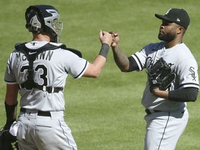 Alex Colome #48 of the Chicago White Sox celebrates with catcher James McCann #33 after recording his fifth save in a 7-5 win over the Detroit Tigers at Comerica Park on August 12, 2020, in Detroit, Michigan.