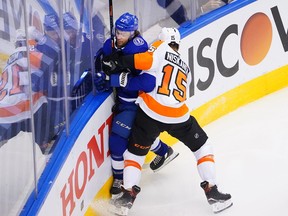 Philadelphia Flyers' Matt Niskanen, right, checks Brayden Point of Tampa Bay Lightning during the third period in an Eastern Conference Round Robin game during the 2020 NHL Stanley Cup Playoff at Scotiabank Arena on August 8, 2020 in Toronto.