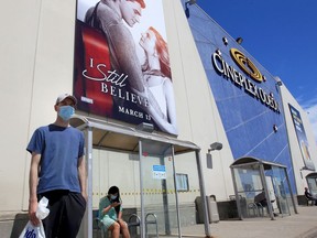 Do you "still believe" in big-screen movie magic? Jesse Rogers, left, waits for a Transit Windsor bus in front of Devonshire Mall's Cineplex Odeon theatres on Thursday, Aug. 13, 2020. The business reopens Friday after a five-month shutdown due to COVID-19 and will present new Hollywood releases.