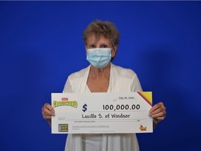Lucille Soulliere, 74, of Windsor, holds her $100,000 lottery winnings.