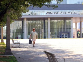 A pedestrian walks north through the open space around Windsor City Hall on Monday, Aug. 24, 2020. City council approved creation of a plan and design for the future civic esplanade and public gathering spot.