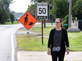 Angie LaMarre and other Baseline Road residents worry they may face huge charges when the city replaces their septic systems with sanitary sewers.