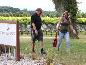 School support staff worker Lindsay Hillier, right, visited Cooper's Hawk Vineyards and The Vines Restaurant on Saturday, Aug. 29, 2020, and was given a brief tour of the grounds by co-owner and winemaker Tom O'Brien. See story.