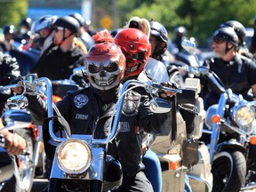 Hundreds of motorcycles, riders and passengers mount their rides for the annual motorcycle run into the county where proceeds will be used to purchase food for the Downtown Mission's meal programs.  See story.