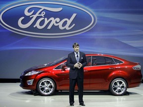 (FILES) This file photo shows former Ford Group Vice President for Marketing and Communications, Jim Farley as he unveils the Ford Verve concept sedan during the press days at the 2008 North American International Auto Show in Detroit on January 13, 2008. - Ford announced on August 4, 2020 that Jim Hackett would step down as chief executive and be replaced by longtime auto executive Jim Farley as the car giant repositions itself. Hackett, 65, will hand over the job to Farley, 58, on October 1, but stay on as a special advisor through March 2021. Farley joined Ford in 2007 after a long tenure at Toyota and currently serves as chief operating officer.The move comes as Ford introduces more electric car models and investors more aggressively in autonomous technology.