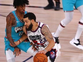 Fred VanVleet #23 of the Toronto Raptors drives the ball against Ja Morant #12 of the Memphis Grizzlies during the fourth quarter at Visa Athletic Center at ESPN Wide World Of Sports Complex, Aug. 9, 2020.