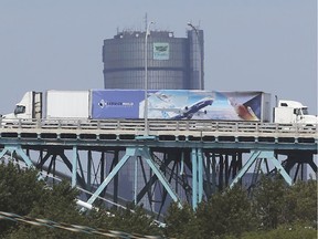 Trucks cross both ways along the Ambassador Bridge on Friday, Aug. 14, 2020. While trade continues, the border will remain closed to non-essential travel till at least Sept. 21, 2020.