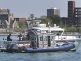 Marine units from the OPP, rear, and Windsor police are shown on the Detroit River near downtown Windsor on May 26, 2020.