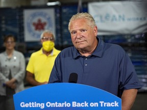 Ontario Premier Doug Ford, who is visiting Windsor today, is shown Aug. 4, 2020, making an announcement with Vic Fedeli, Minister of Economic Development, Job Creation and Trade at Clean Works Corp., in Beamsville, Ont.