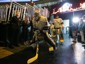 Jordan Kooy of the Knights prepares to lead the team onto the ice for their first game of the season against the Windsor Spitfires at Budweiser Gardens in London. Photograph taken on Friday September 21, 2018. Mike Hensen/The London Free Press/Postmedia Network