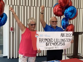 Raymond Lillington and his wife Gaye hold their cheque after winning the lottery for the second time during a presentation ceremony in Halifax on Wednesday, Aug. 19, 2020.