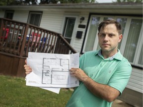 Disappointed. James Lindeman is pictured on Aug. 26, 2020, with the plans to his accessory dwelling he's hoping to build at the rear of his South Windsor property on Longfellow Avenue.