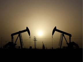 Pump jacks operate at sunset in Midland, Texas, February 11, 2019.