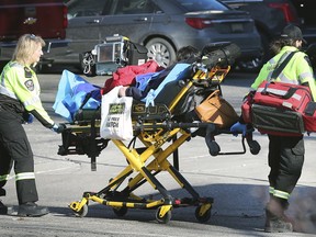 In this Dec. 23, 2019, file photo, paramedics transport a woman suspected of an overdose at the Downtown Mission in Windsor. Witnesses said the woman was treated with Narcan at the scene then transported to hospital.