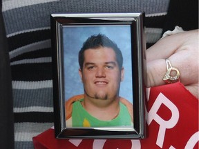 Christine Gaudet holds a photo of her son Julien on April 23, 2012. Julien's organs were donated after he was killed in an accident 11 months earlier.