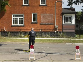 A Windsor police officer is shown Aug. 23, 2020, at the scene of a violent incident in the area of Bloomfield Road and Brock Street in Windsor's west end.