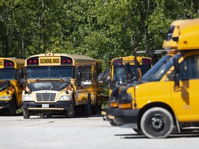 School buses are parked in a lot off Hudson Avenue in West Windsor, Tuesday, August 18, 2020.