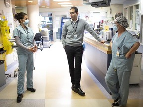 In this file photo from May 2020, Windsor Regional Hospital Chief of Staff Dr. Wassim Saad meets with intensive care unit manager Kaithlyn Sheehan, left, and Karen Riddell, right, vice- president of critical care.