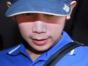 In this file photo taken Sept. 3, 2012, Vorayuth Yoovidhya, grandson of late Red Bull founder Chaleo Yoovidhaya, is seen during a police investigation in Bangkok.