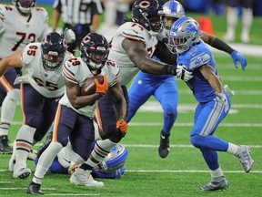 DETROIT, MI - SEPTEMBER 13: Tarik Cohen #29 of the Chicago Bears runs for a first down during the fourth quarter of the game against the Detroit Lions at Ford Field on September 13, 2020 in Detroit, Michigan. Chicago defeated Detroit 27-23.