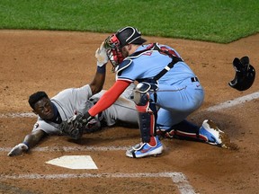 Mitch Garver of the Minnesota Twins defends home plate from Daz Cameron of the Detroit Tigers during the fifth inning of the game at Target Field on September 22, 2020 in Minneapolis, Minnesota.