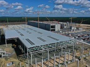 In this aerial view from a drone, the future assembly line hall stands among other future factory buildings at the construction site of the new Tesla Gigafactory near Berlin on Sept. 6, 2020 near Gruenheide, Germany. Tesla is planning to begin electric car production at the site by the summer of 2021 with 12,000 employees and an output of at least 100,000 cars annually.