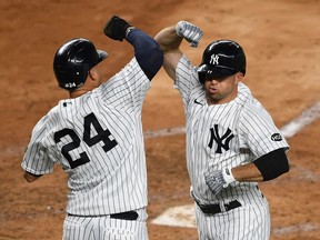Brett Gardner celebrates with Gary Sanchez of the New York Yankees after Gardner hit a two-run home run during the fourth inning against the Toronto Blue Jays at Yankee Stadium on September 17, 2020 in the Bronx borough of New York City.