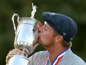 Bryson DeChambeau of the United States kisses the championship trophy in celebration after winning the 120th U.S. Open Championship on September 20, 2020 at Winged Foot Golf Club in Mamaroneck, New York.