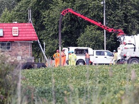 Kingsville firefighters and fuel handling specialists continue to work at Arner Stop fuel staton at the intersection of County Road 23 (Arner Townline) and County Road 20 Wednesday September 16, 2020.