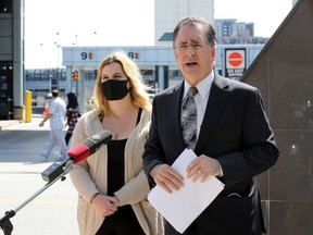 Brian Masse, right, MP Windsor West, and Shayla Costello at international border crossing of Detroit Windsor Tunnel on Park Street East Thursday.  Masse is calling for our federal government to allow more exemptions at the border, especially those involving the last wishes of ailing relatives.