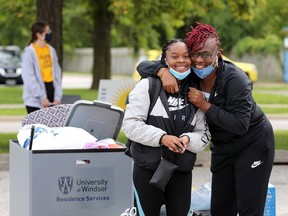A different kind of campus. University of Windsor first-year student Kaijah Tyne, left, is hugged by her mother Neisha Tyne as the Toronto family helped Kaijah move into Alumni Hall on Sunday, Sept. 6, 2020. Kaijah will be studying human kinetics.