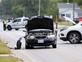 Lasalle Police investigate following a two-vehicle collision on Front Road South near Martin Lane Sunday. Traffic was detoured for both north and south bound lanes on Front Road for several hours.  Essex-Windsor EMS attended with four ambulances for the injured which included children.  (NICK BRANCACCIO/Windsor Star)