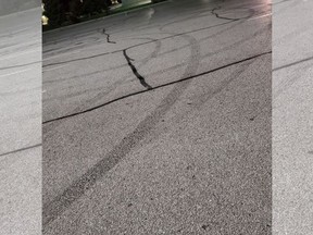 This photo from Windsor police shows tire marks left by a vehicle spinning erratically in a Windsor on Saturday, Sept. 26, 2020.