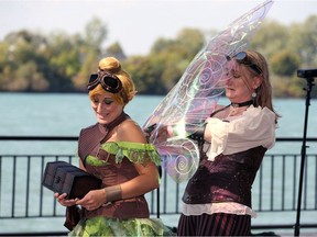 Uncommon Weekend participant Sylvia Ward, left, has her Tinkerbell wings adjusted by Natasha von Bodenhausen Saturday.