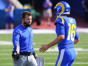 Los Angeles Rams head coach Sean McVay greets quarterback Jared Goff (16) following his touchdown run against the Buffalo Bills at Bills Stadium.