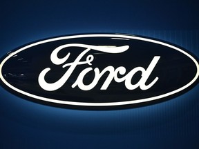 (FILES) In this file photo a Ford logo is seen at the 2016 Washington Auto Show on January 27, 2015 in Washington, DC.