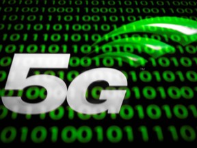 (FILES) This file illustration picture taken on February 18, 2019  shows the 5G wireless technology logo displayed on a tablet in Paris. - France will move forward with its planned deployment of 5G telecom networks despite detractors who would prefer "the Amish model" and "going back to the oil lamp", French President said on September 14, 2020.