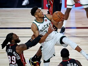 Milwaukee Bucks forward Giannis Antetokounmpo drives to the basket against Miami Heat forward Jae Crowder during the third quarter in game three of the second round of the 2020 NBA Playoffs at ESPN Wide World of Sports Complex.