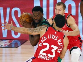 Toronto Raptors guard Fred VanVleet (23) and guard Matt Thomas (right) pressure Boston Celtics guard Kemba Walker (left) during the second half of game five of the second round in the 2020 NBA Playoffs at ESPN Wide World of Sports Complex in Lake Buena Vista, Florida, on Sept. 7, 2020.