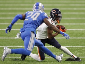 Chicago Bears wide receiver Darnell Mooney runs after a catch against Detroit Lions cornerback Amani Oruwariye during the second quarter at Ford Field.