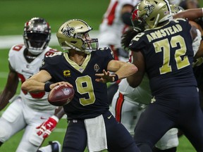 New Orleans Saints quarterback Drew Brees throws against the Tampa Bay Buccaneers during the first quarter at the Mercedes-Benz Superdome.