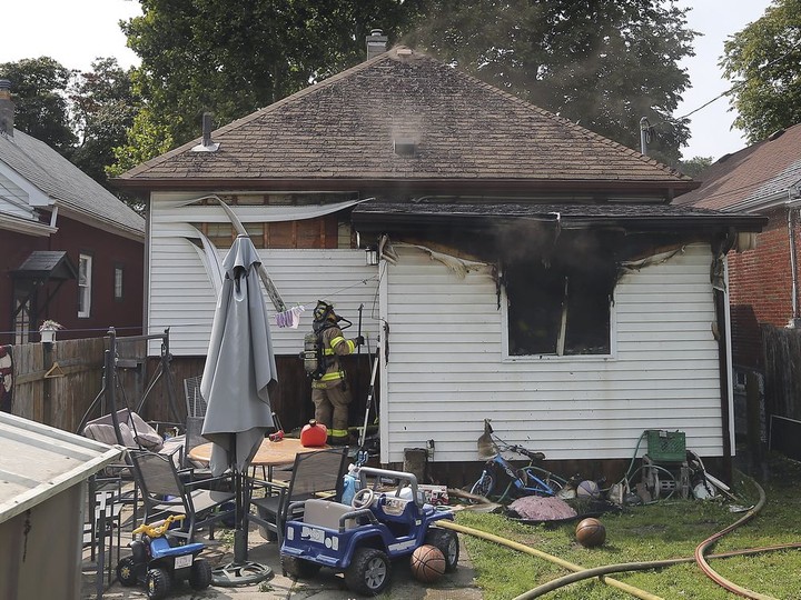  Windsor firefighters are shown at the scene of a house fire on Tuesday, September 15, 2020 in the 1200 block of Hickory Rd. Four adults and two children were displaced and a neighbour who tried to extinguish the fire was treated for minor smoke inhalation.